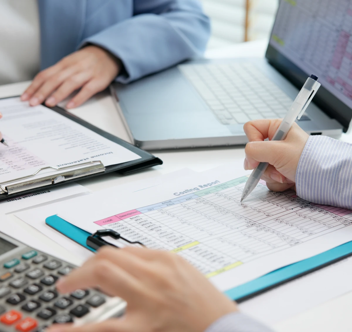People analyzing financial data at desk